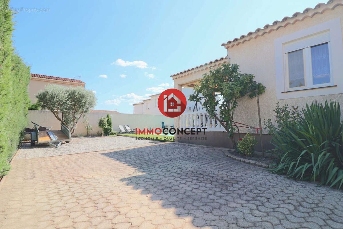 Maison à LAUDUN-L&#039;ARDOISE