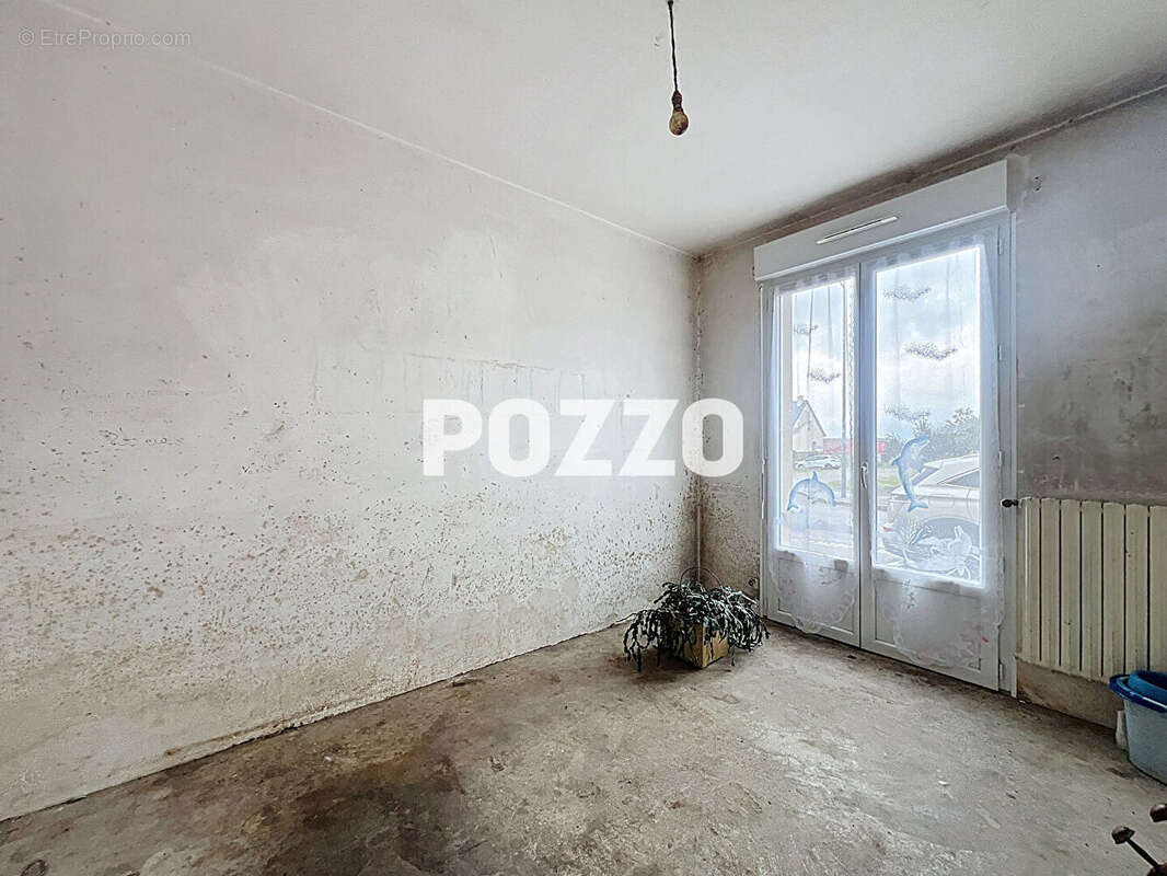 Maison à JUVIGNY-LE-TERTRE