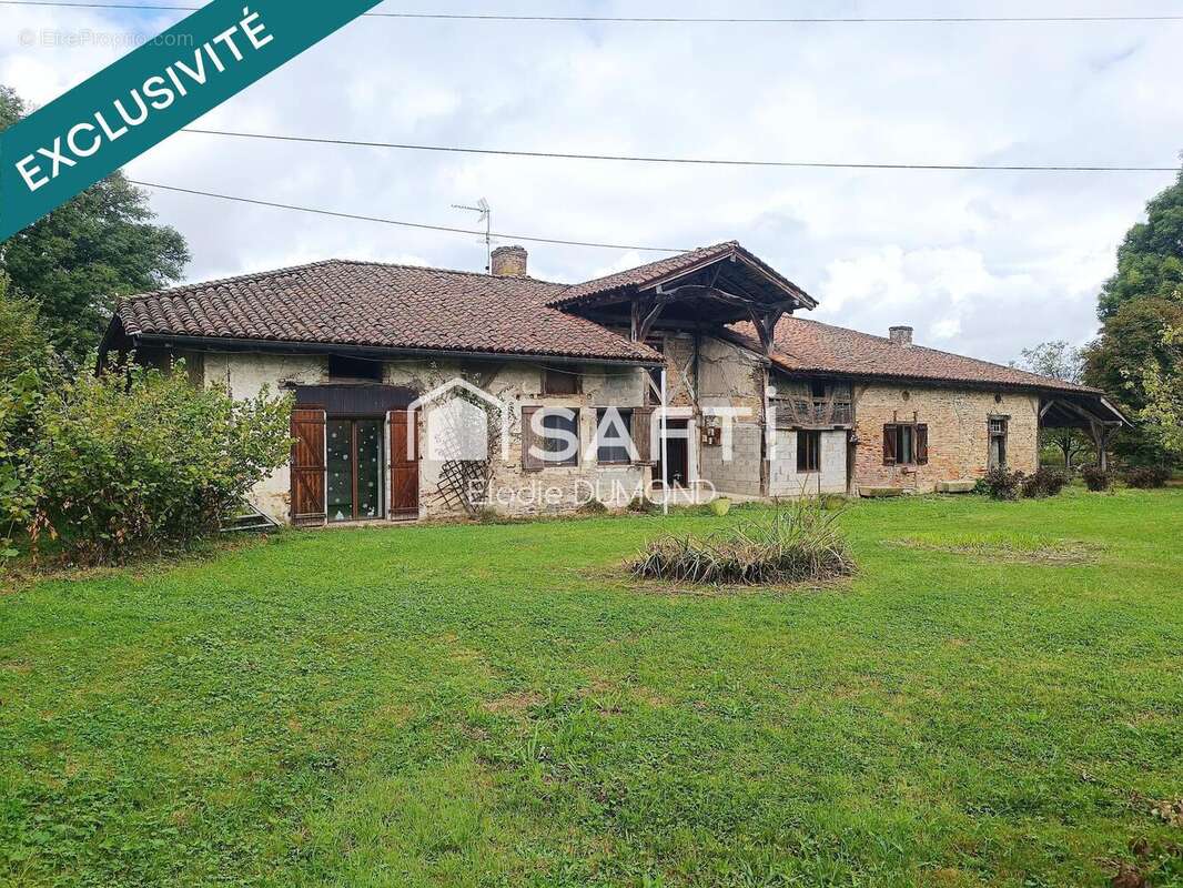 Photo 2 - Maison à SAINT-ETIENNE-DU-BOIS